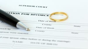 Petition for divorce paper with a pen and wedding ring