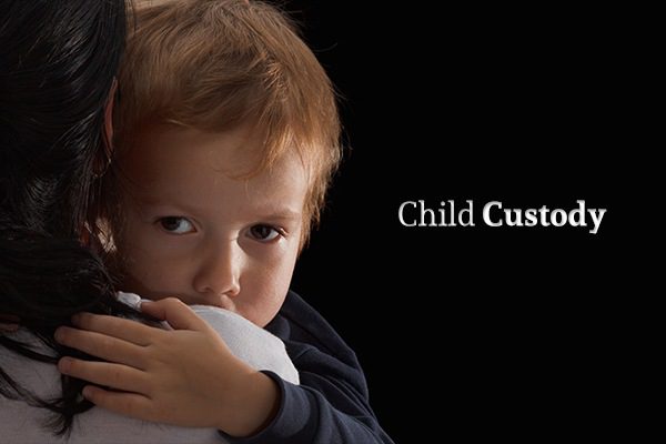 A child being held by his mother beside the words "Child Custody"
