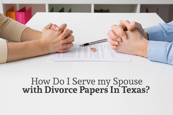 A man and a woman sit across from each other at a white table with documents between them above the words "How Do I Serve my Spouse with Divorce Papers In Texas"