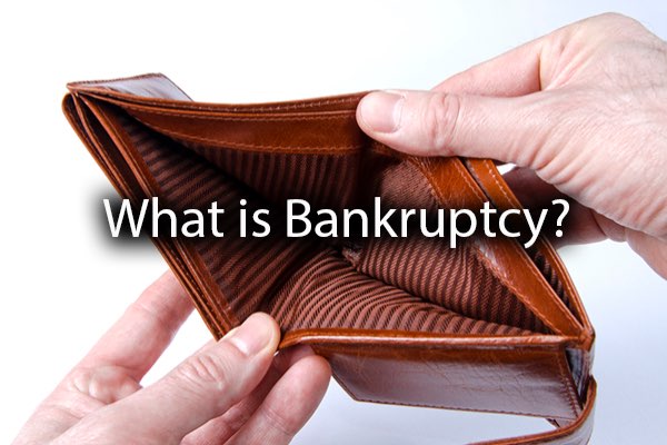 An individual looking at an empty wallet with the words, what is bankruptcy?